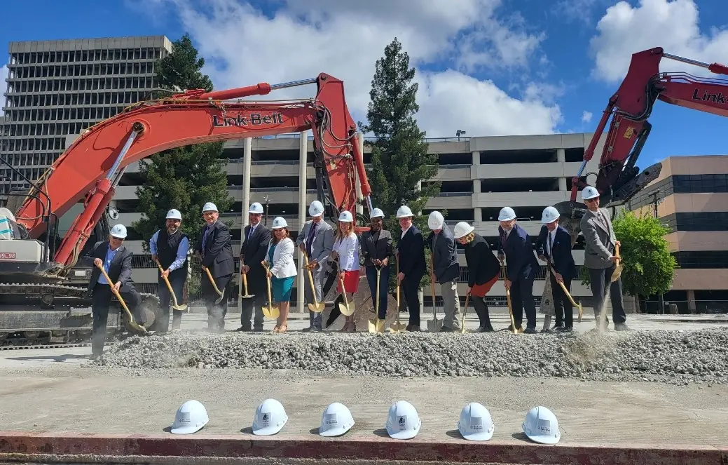 monarch groundbreaking ceremony with hard hats and golden shovels