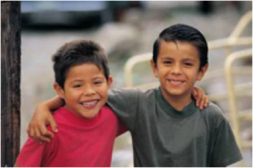 Two young boys smiling.